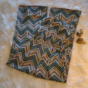 Long strapless geometric print romper.